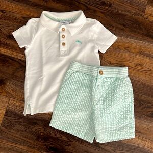 Tommy Bahama size 2T outfit. White polo with green stripped shorts.